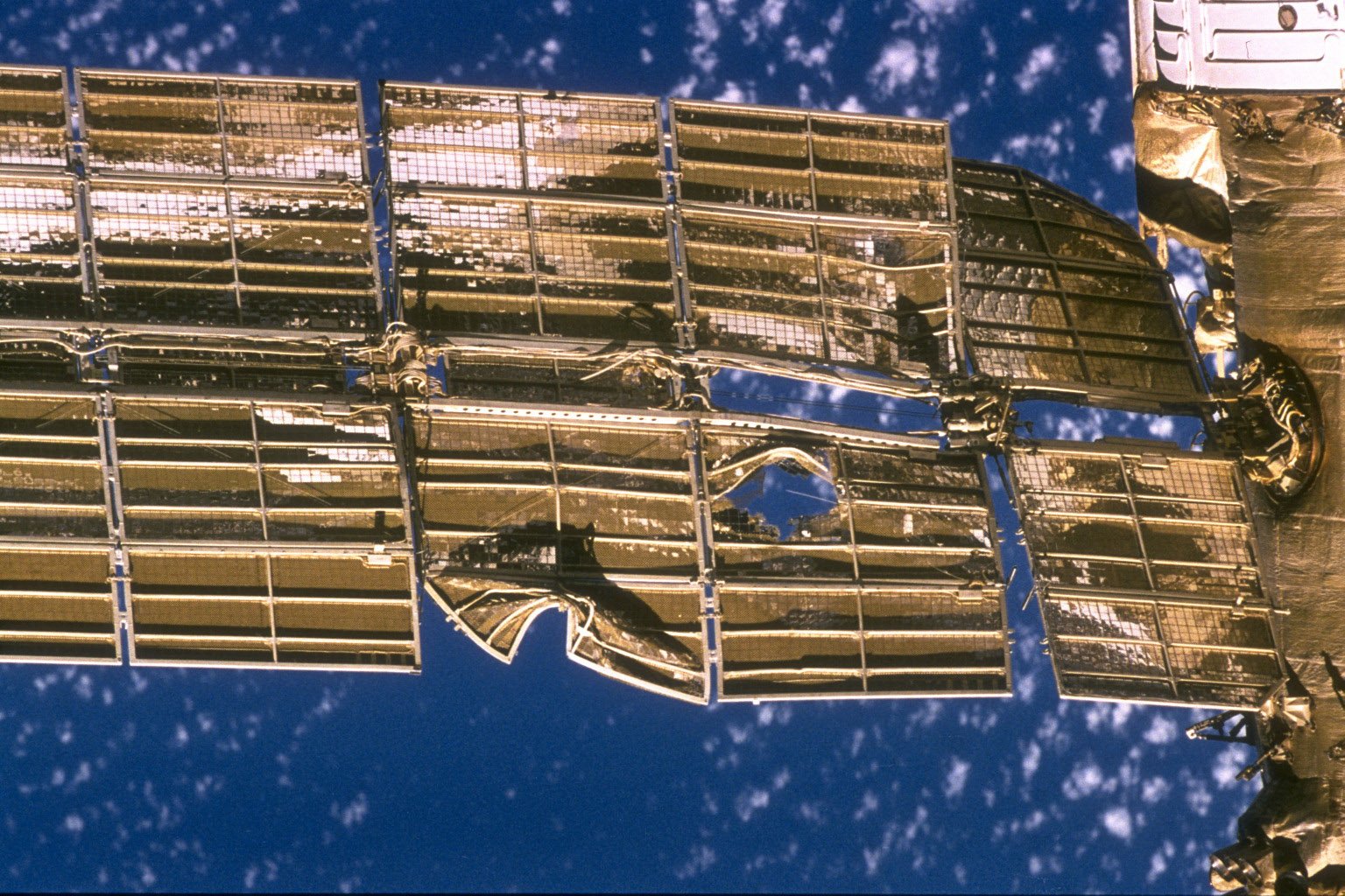 383927 13: SOCIETY PHOTO: A close-up of the solar array panel on the Spektr module of Russia's Mir Space Station shows damage caused by the impact of a Russian Progress unmanned resupply vehicle that collided with the space station on 25 June 1997, causing Spectrum of depression.  Mir is nearing the end of its existence as Russia plans to lift the spacecraft out of orbit in late February 2001 in a controlled crash to drop the space station safely into the Pacific Ocean.  (Photo by NASA/Newsmakers)